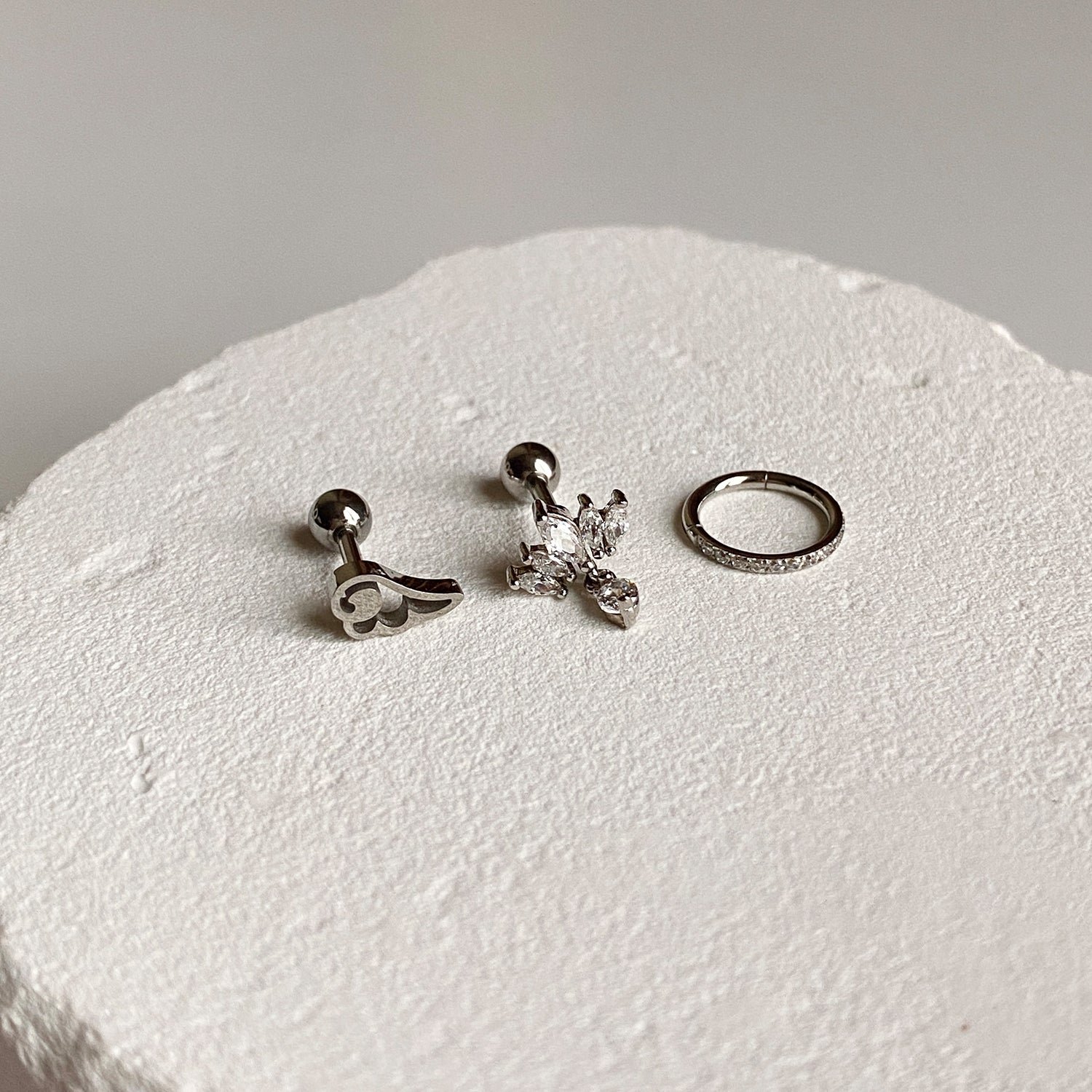 SET-027 サージカルキュービッククラウンエンジェルウィングセグメントリングピアセット